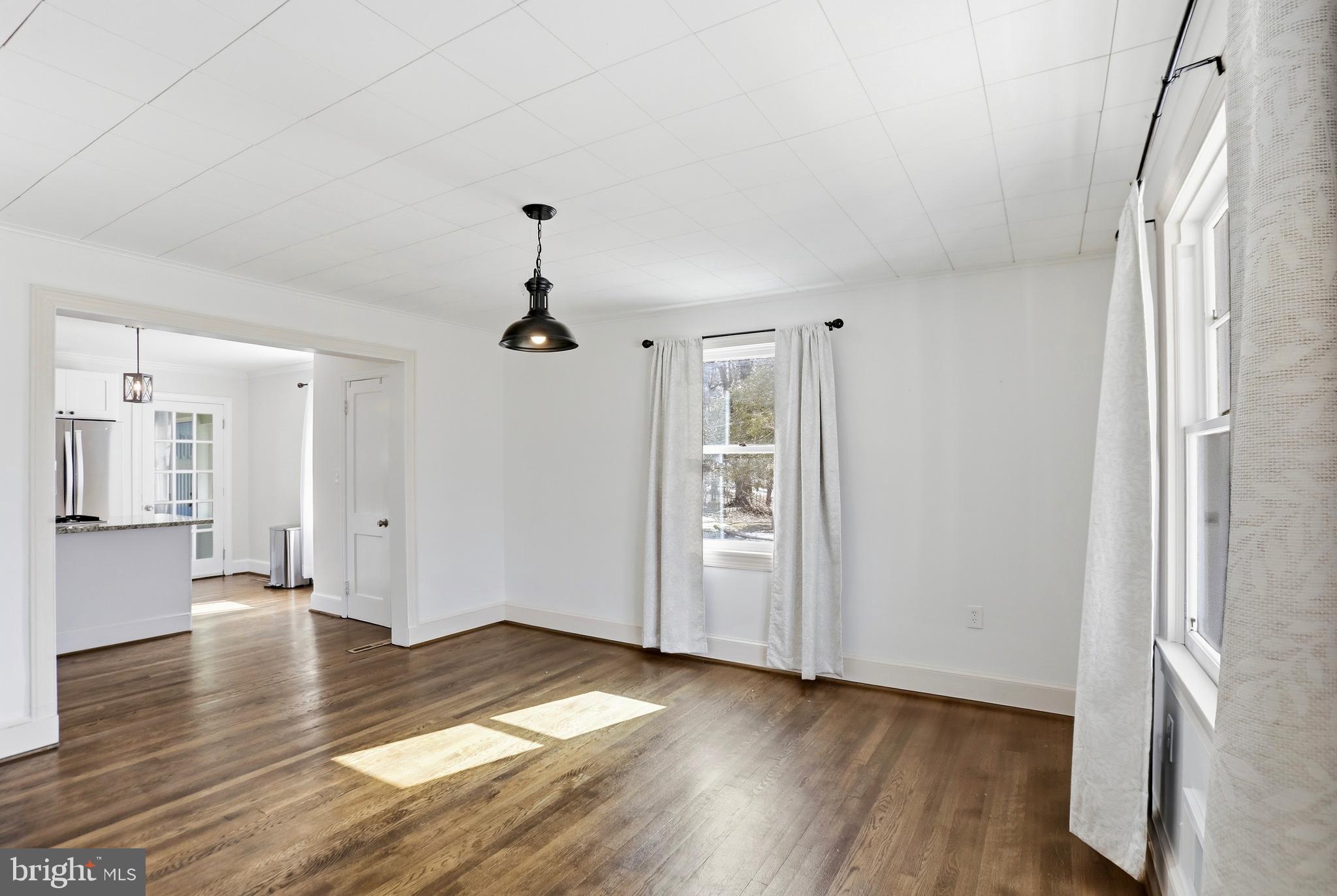 12242 Harpers Ferry Road Purcellville, VA 20132 - Photo 20 of 49 a view of empty room with wooden floor