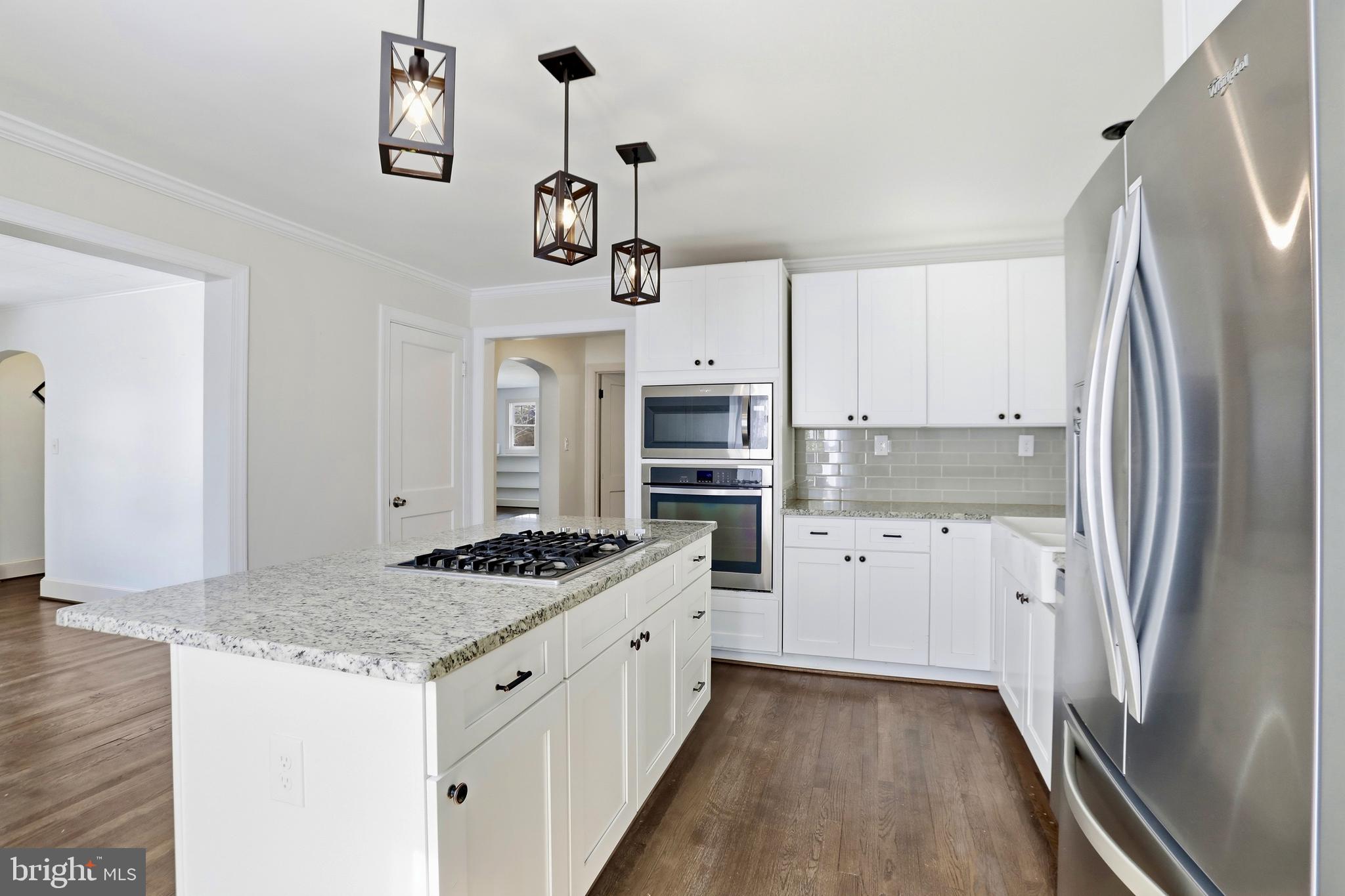 12242 Harpers Ferry Road Purcellville, VA 20132 - Photo 28 of 49 a kitchen with stainless steel appliances granite countertop a refrigerator a stove and white cabinets