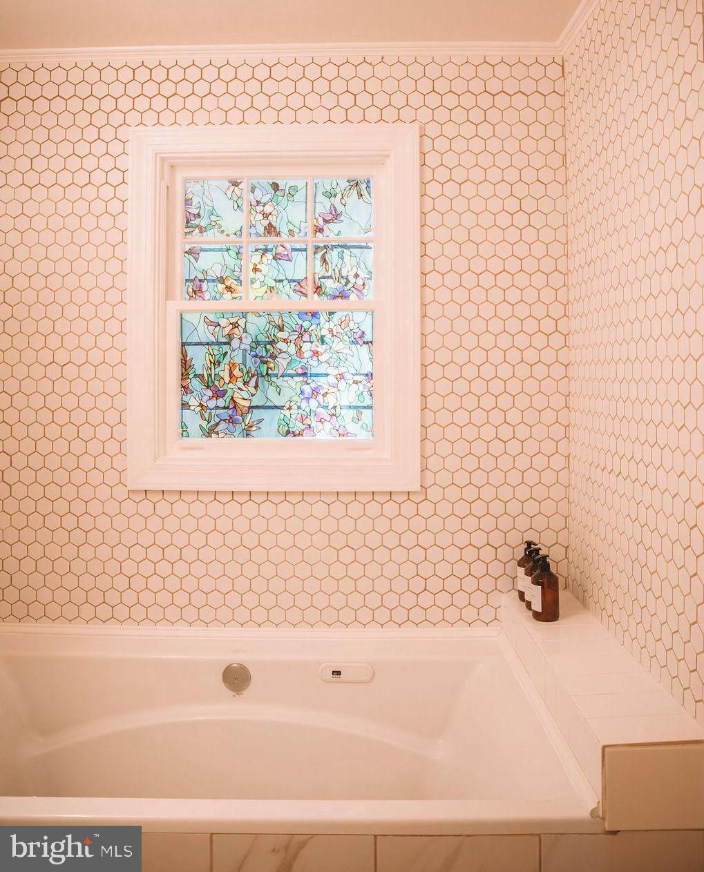12242 Harpers Ferry Road Purcellville, VA 20132 - Photo 33 of 49 a bathroom with a bathtub and a shower