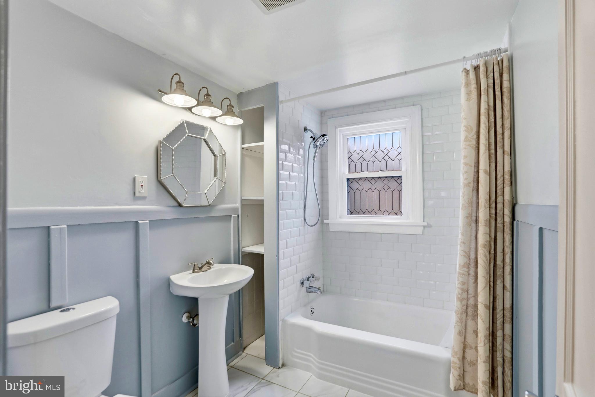 12242 Harpers Ferry Road Purcellville, VA 20132 - Photo 41 of 49 a bathroom with a sink a toilet and a mirror