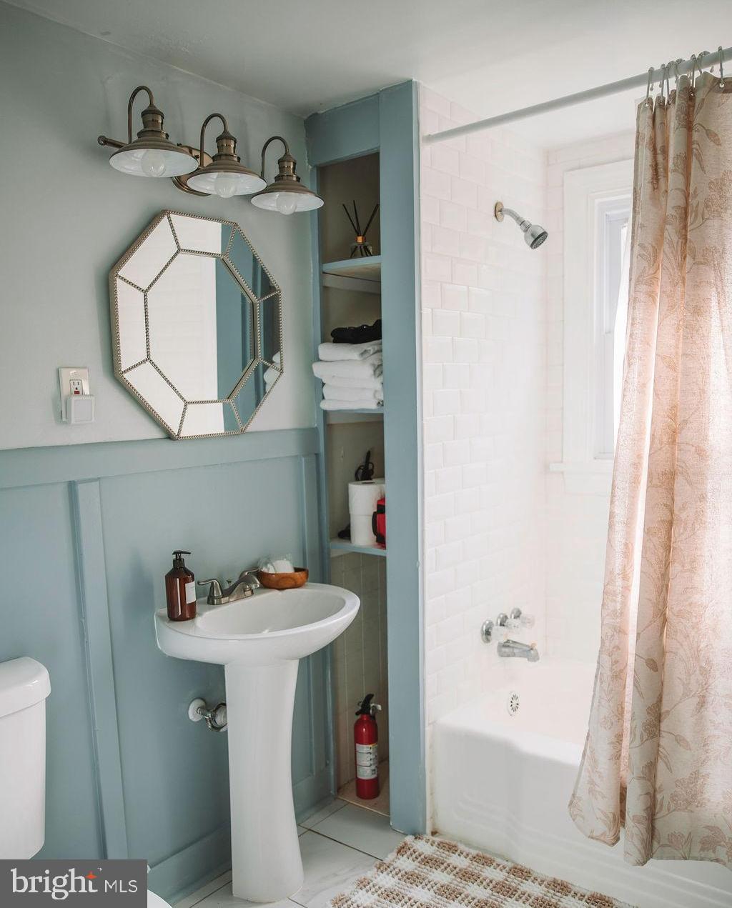 12242 Harpers Ferry Road Purcellville, VA 20132 - Photo 42 of 49 a bathroom with a sink toilet and shower
