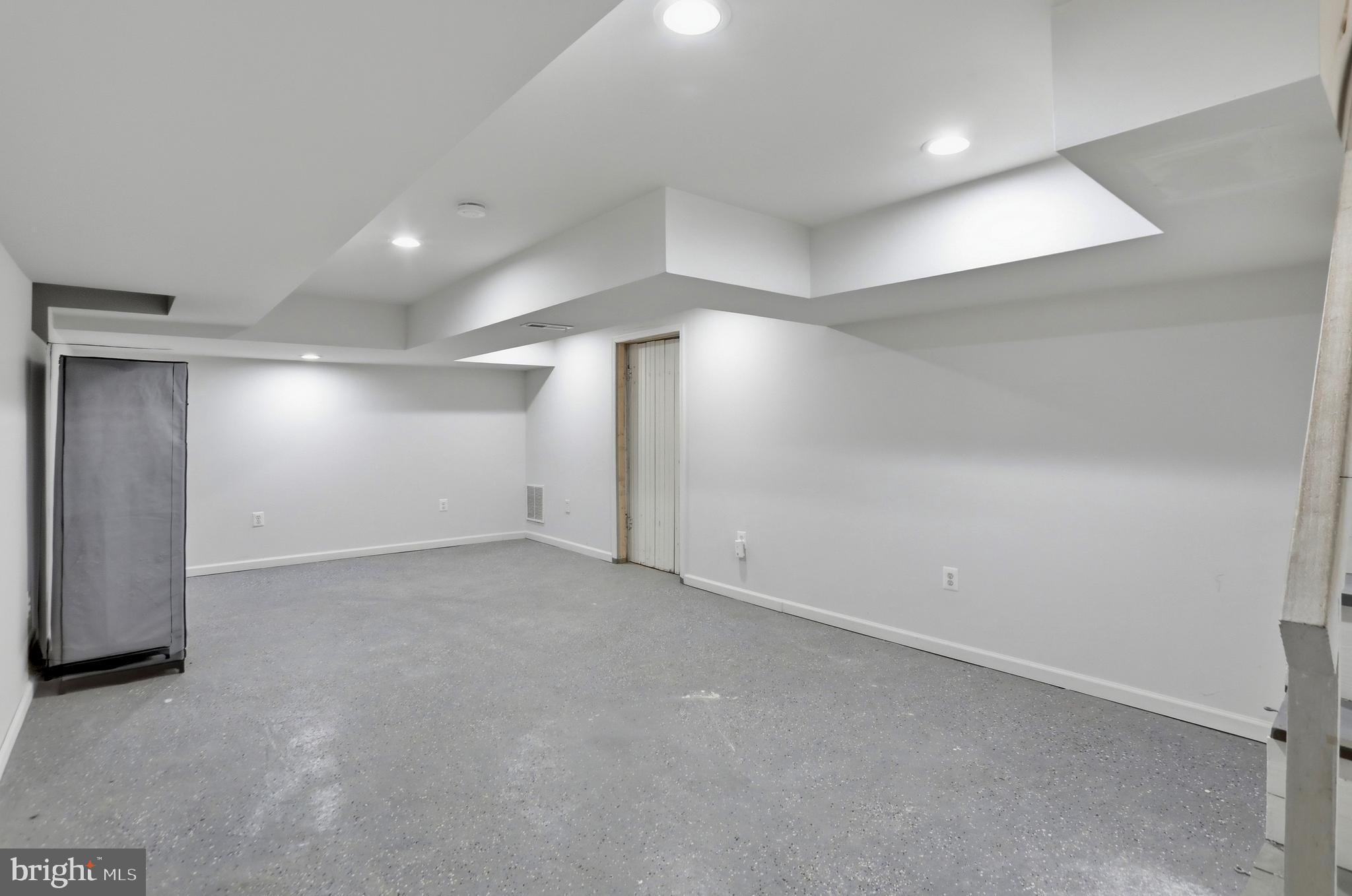 12242 Harpers Ferry Road Purcellville, VA 20132 - Photo 43 of 49 an empty room with a empty space and windows