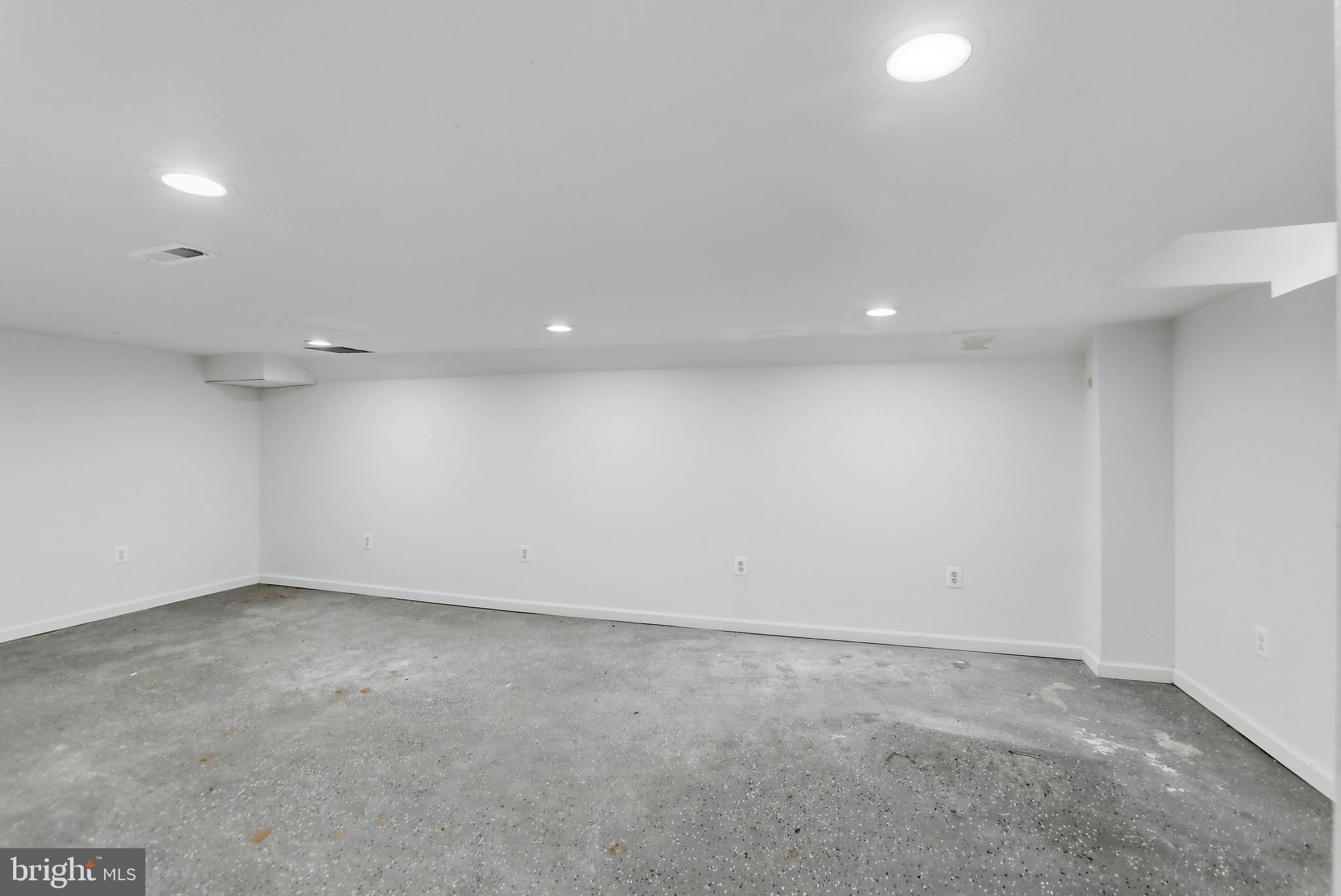 12242 Harpers Ferry Road Purcellville, VA 20132 - Photo 45 of 49 an empty room with a empty space and window