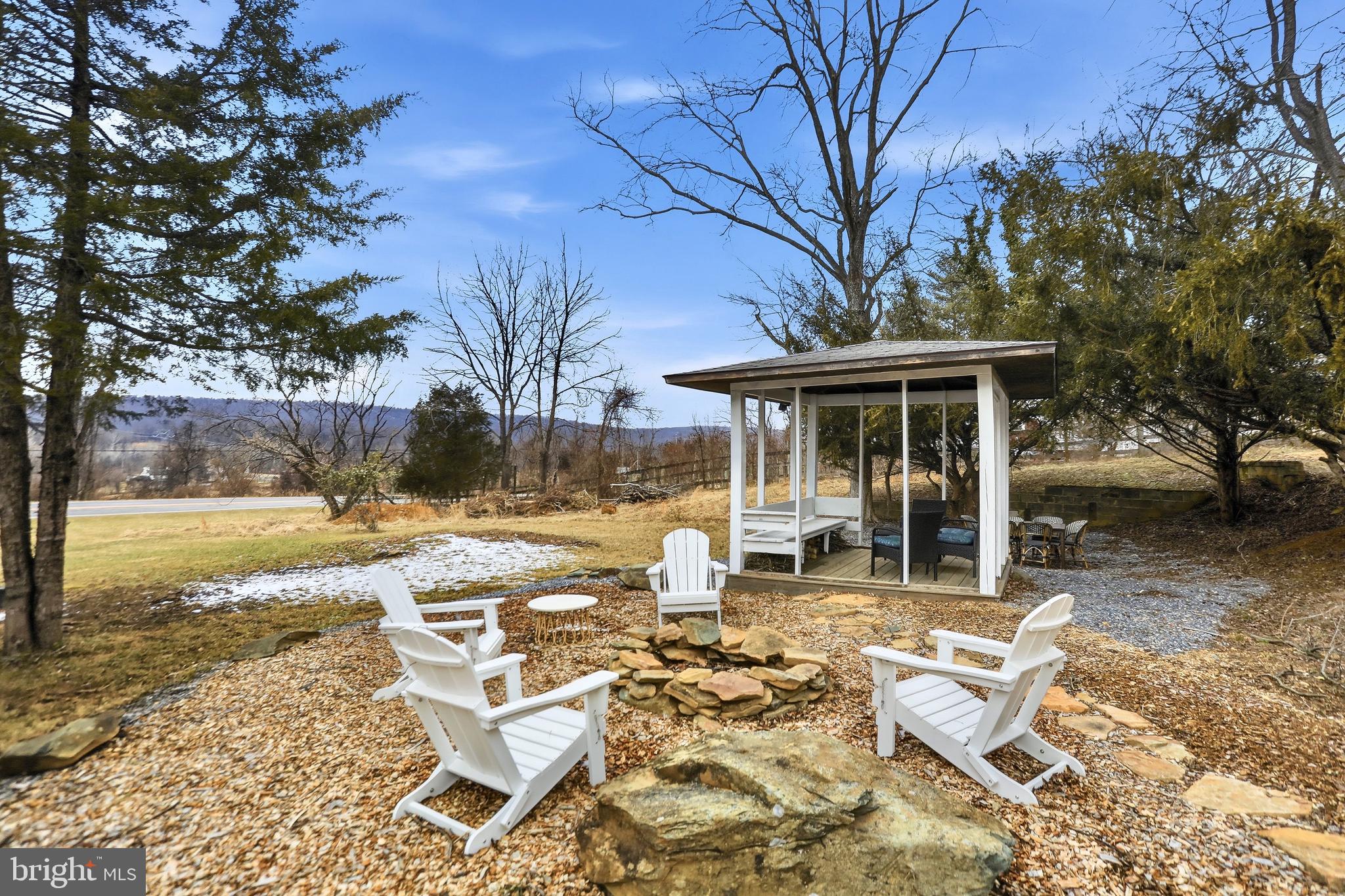 12242 Harpers Ferry Road Purcellville, VA 20132 - Photo 5 of 49 a view of a house with backyard porch and sitting area