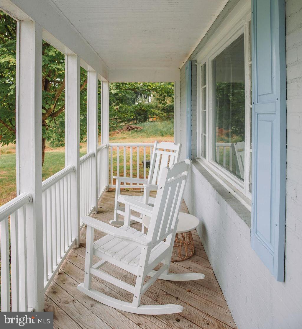 12242 Harpers Ferry Road Purcellville, VA 20132 - Photo 10 of 49 a view of entryway with wooden floor and a front door