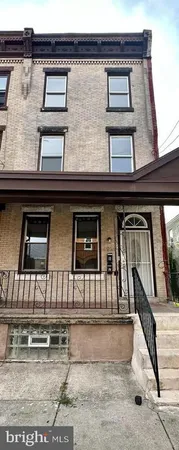 a view of a house with large windows