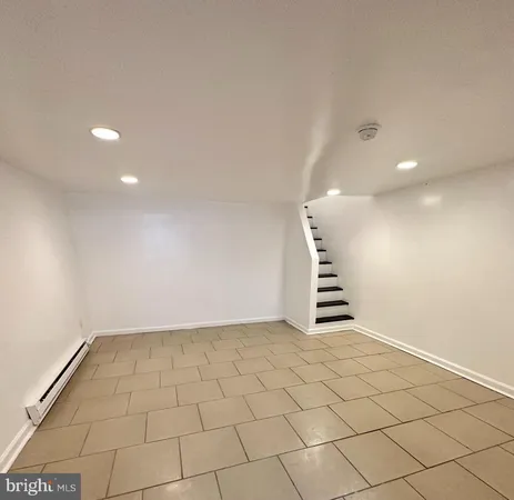 a view of an empty room with stairs