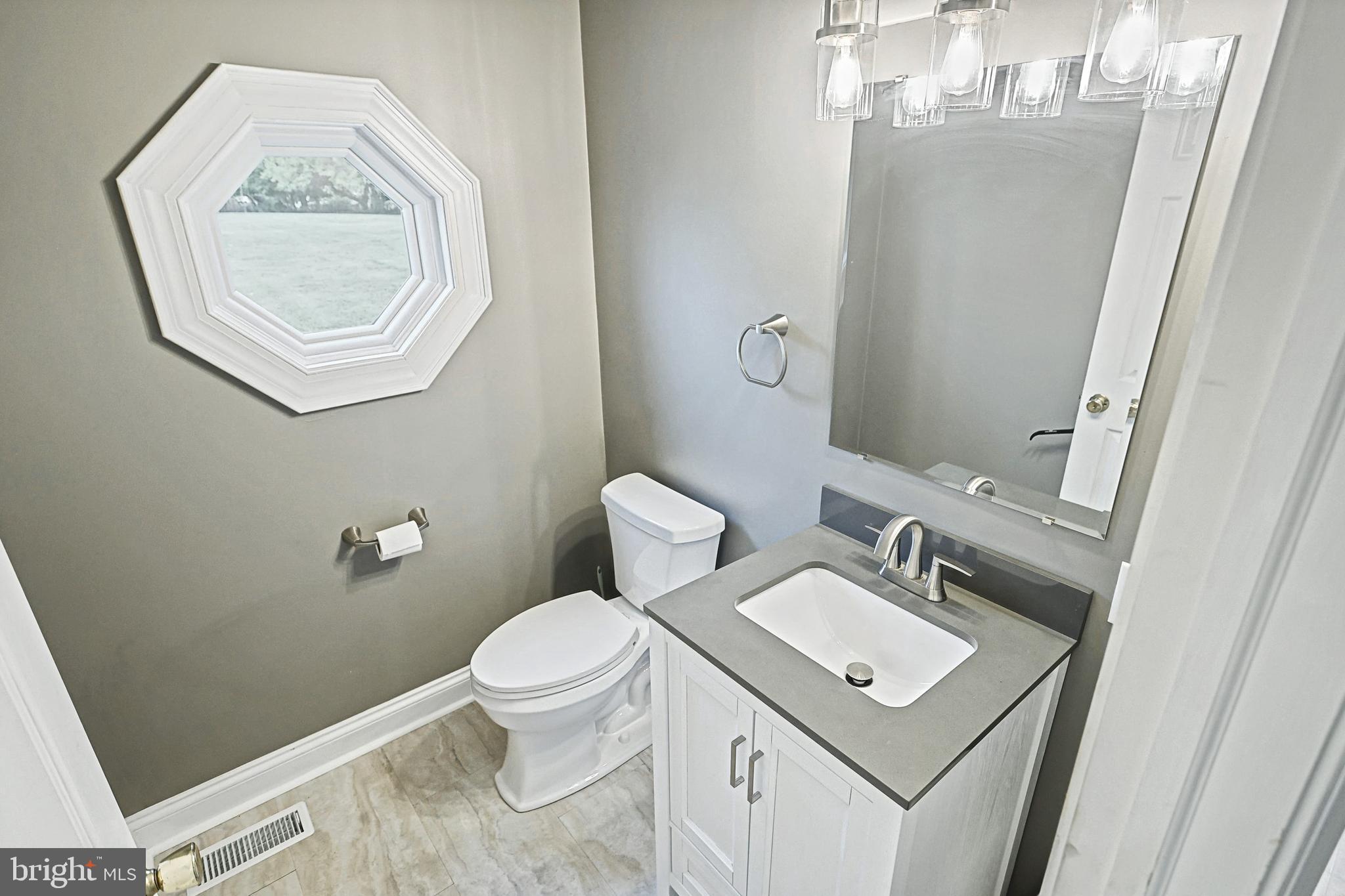 302 Pinetown Road Hanover, PA 17331 - Photo 26 of 55 a bathroom with a toilet a sink and mirror