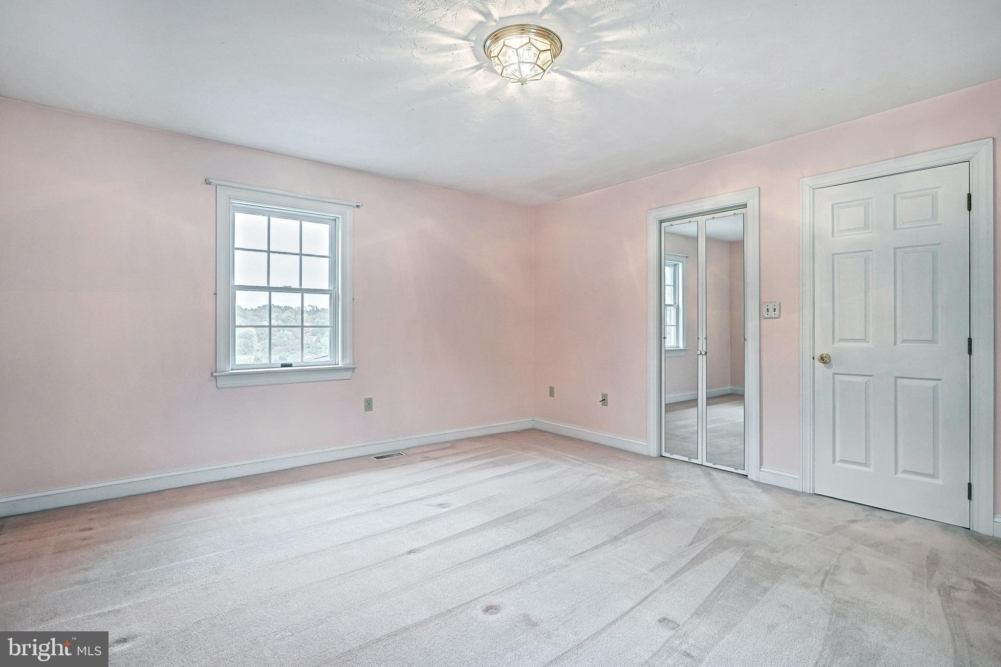 302 Pinetown Road Hanover, PA 17331 - Photo 35 of 55 an empty room with chandelier fan and windows