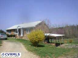 10011 Tribble Road Beaverdam, VA 23015 - Photo 1 of 8 a front view of a house with a yard
