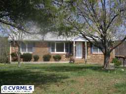 10011 Tribble Road Beaverdam, VA 23015 - Photo 2 of 8 a front view of a house with a yard