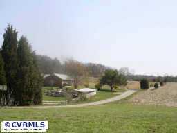 10011 Tribble Road Beaverdam, VA 23015 - Photo 3 of 8 a view of a lake with a big yard