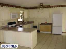 10011 Tribble Road Beaverdam, VA 23015 - Photo 7 of 8 a kitchen with stainless steel appliances granite countertop a sink and a stove