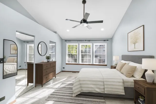 a bedroom with a bed dresser and a window