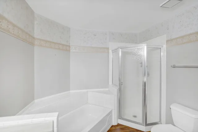 a bathroom with a bathtub and a shower