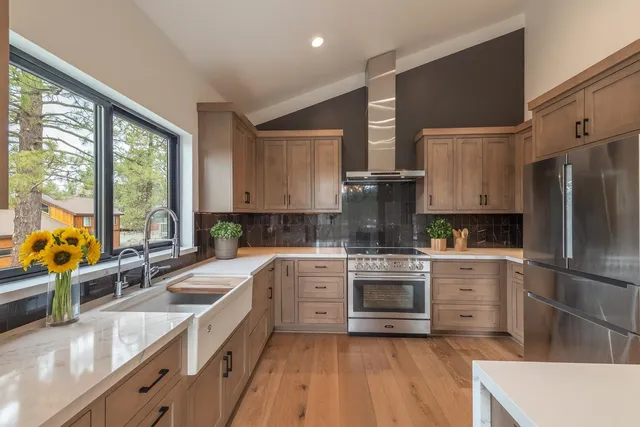 a kitchen with a sink stove and refrigerator