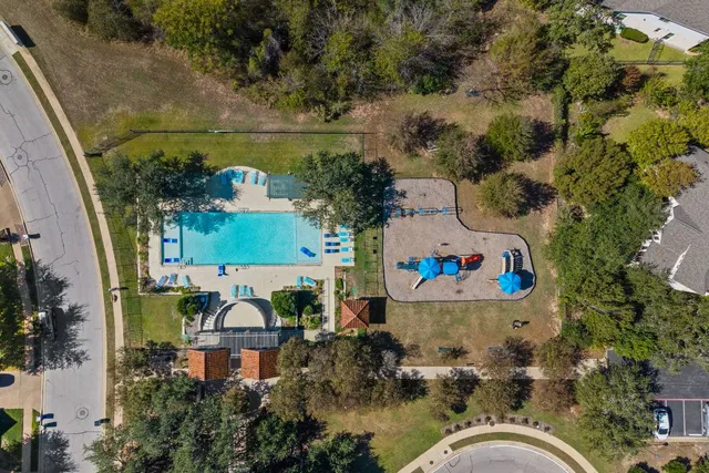 an aerial view of house with yard swimming pool and outdoor seating