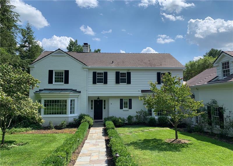 Lovely brick home on private lane off of Country Club Road.  Ornamental trees, mature pines and an apple orchard are the backdrop for this classic home.
