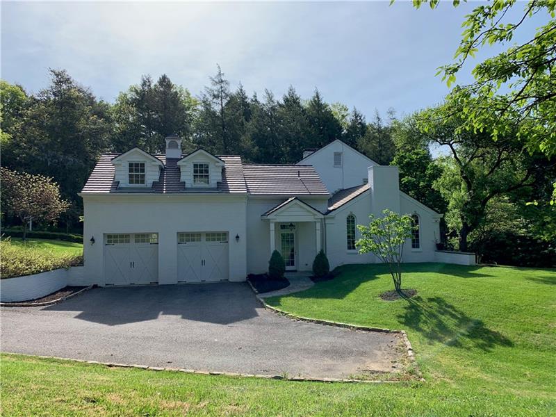 2 Farmhill Road Sewickley, PA 15143 - Photo 2 of 25 Side of the house showing garage addition and door to Mudroom. Family Room has the arched windows and chimney.