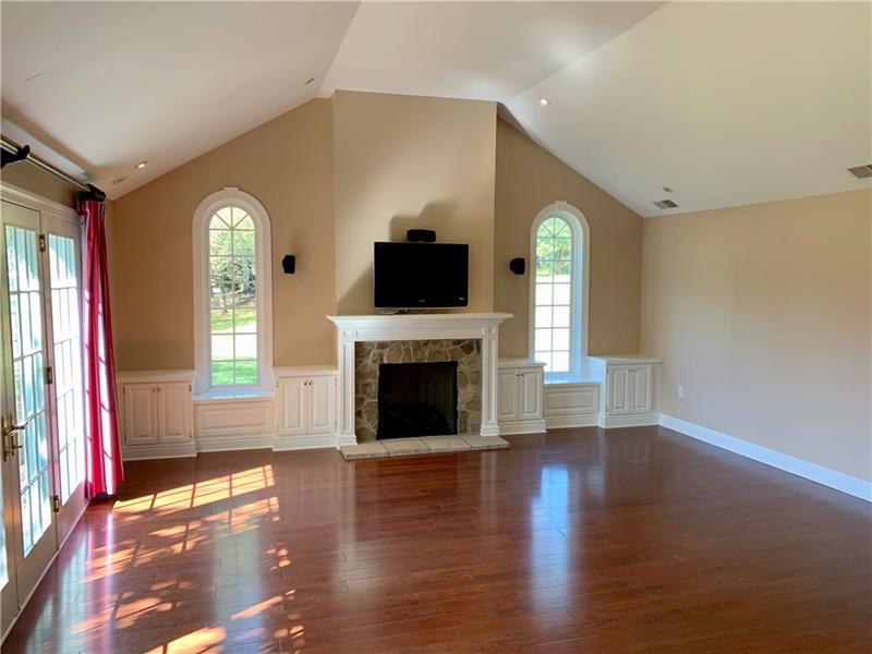 2 Farmhill Road Sewickley, PA 15143 - Photo 13 of 25 Large, bright Family Room off of the Kitchen. Notice gas fireplace, built-in cabinets, sound system and French doors.