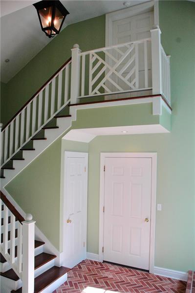 2 Farmhill Road Sewickley, PA 15143 - Photo 15 of 25 Staircase with Chippendale details leads to space above garage that is ready for your creative touches. It is a large, bright, open space with many possibilities! Door leads to new 2-car garage.