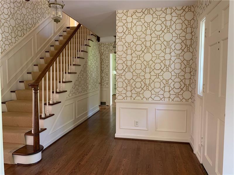 2 Farmhill Road Sewickley, PA 15143 - Photo 3 of 25 Entry with hardwood floors and wainscoting is very welcoming.