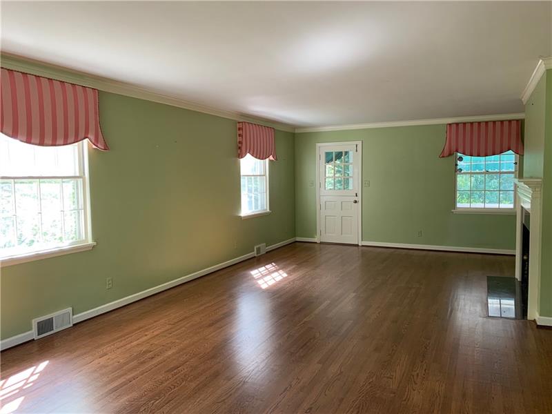 2 Farmhill Road Sewickley, PA 15143 - Photo 4 of 25 Large Living room with gas fireplace, bookcase, bay window and door to covered porch.