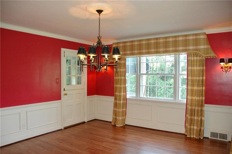 2 Farmhill Road Sewickley, PA 15143 - Photo 6 of 25 Dining Room has view of backyard and Dutch door to porch. Hardwood floors, chair rail and crown moulding are classic details.
