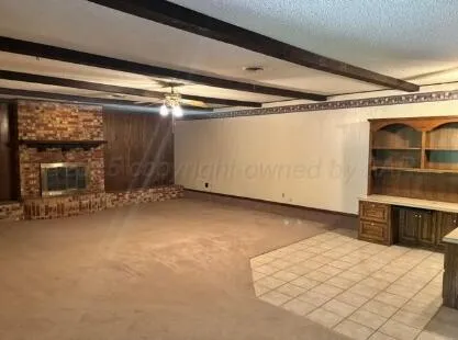 a view of a room with wooden walls