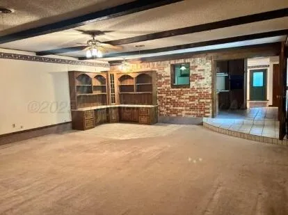 a view of empty room with windows