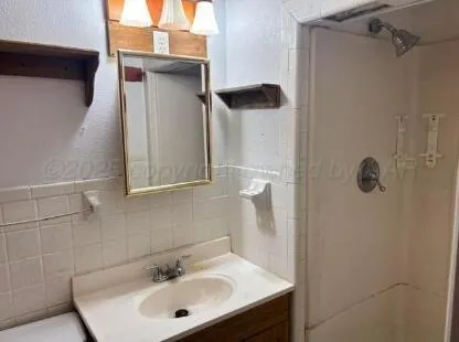a bathroom with a sink and mirror