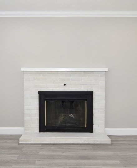 124 Lake Street Bellingham, MA 02019 - Photo 13 of 39 a fireplace with a hallway