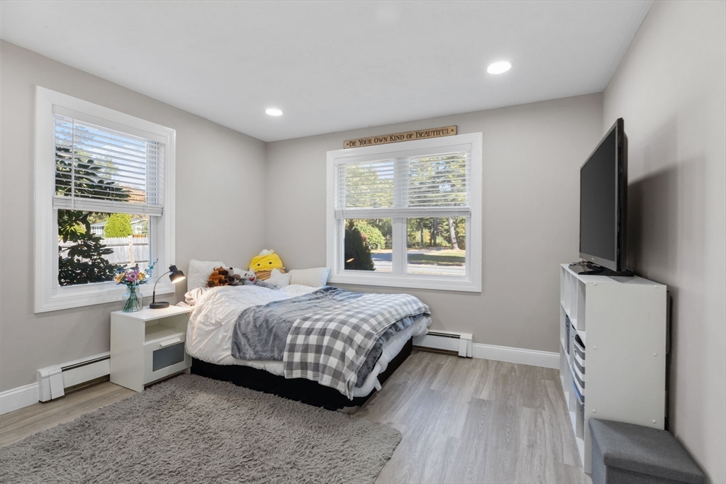 124 Lake Street Bellingham, MA 02019 - Photo 16 of 39 a bedroom with a bed and a flat screen tv