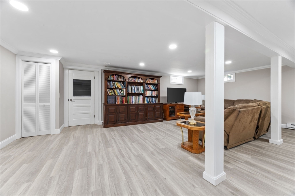 124 Lake Street Bellingham, MA 02019 - Photo 20 of 39 a living room with furniture and a wooden floor