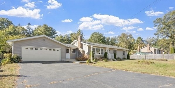 124 Lake Street Bellingham, MA 02019 - Photo 2 of 39 a view of swimming pool with tree in front of it