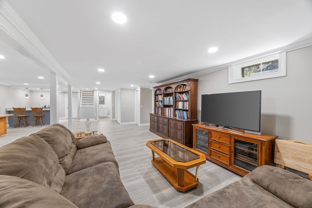 124 Lake Street Bellingham, MA 02019 - Photo 21 of 39 a living room with furniture and a flat screen tv