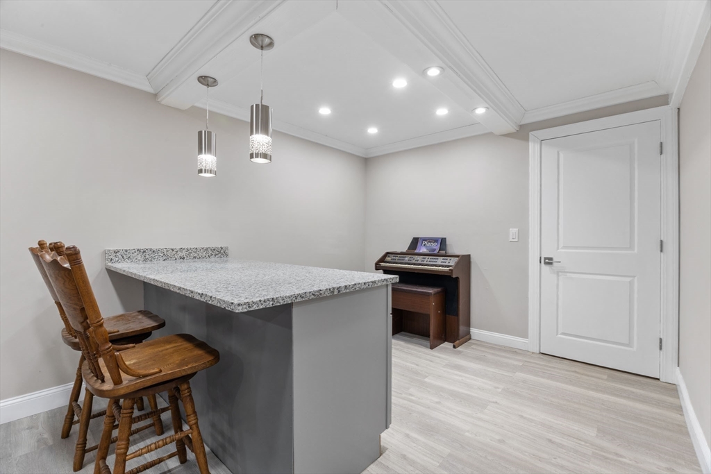 124 Lake Street Bellingham, MA 02019 - Photo 22 of 39 a kitchen that has a table and chairs in it