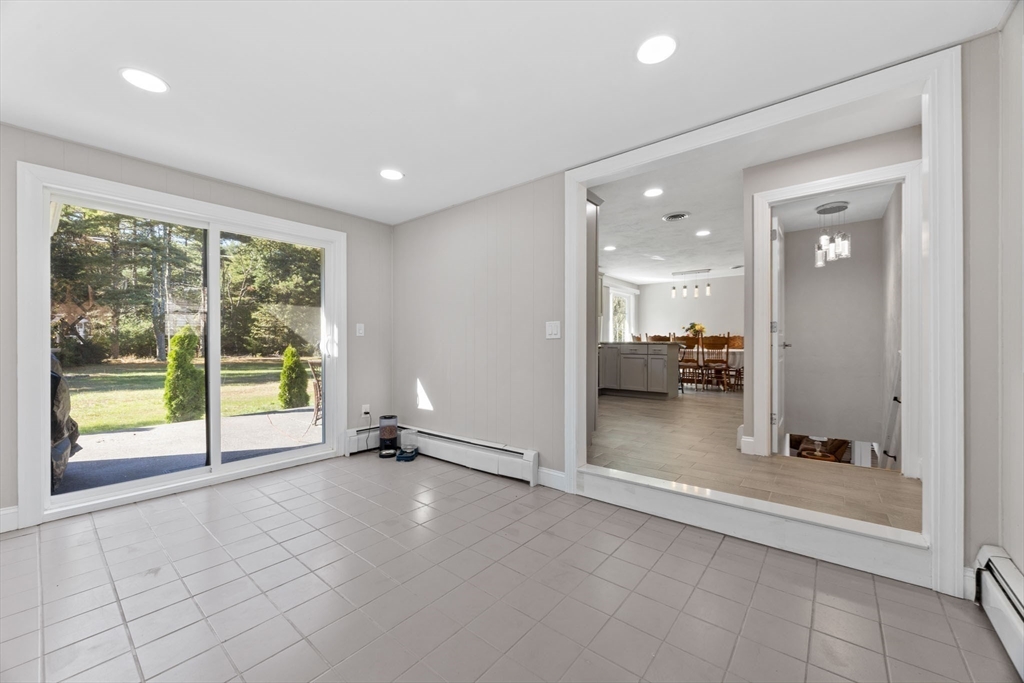 124 Lake Street Bellingham, MA 02019 - Photo 3 of 39 a view of an empty room with a window