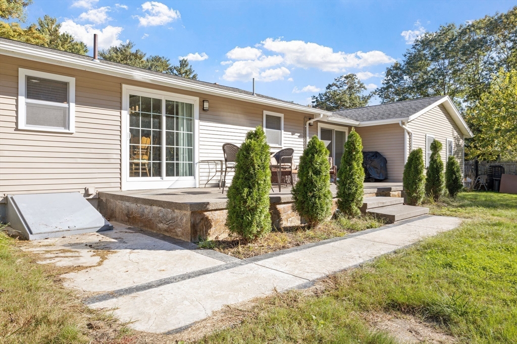 124 Lake Street Bellingham, MA 02019 - Photo 31 of 39 a front view of a house with garden