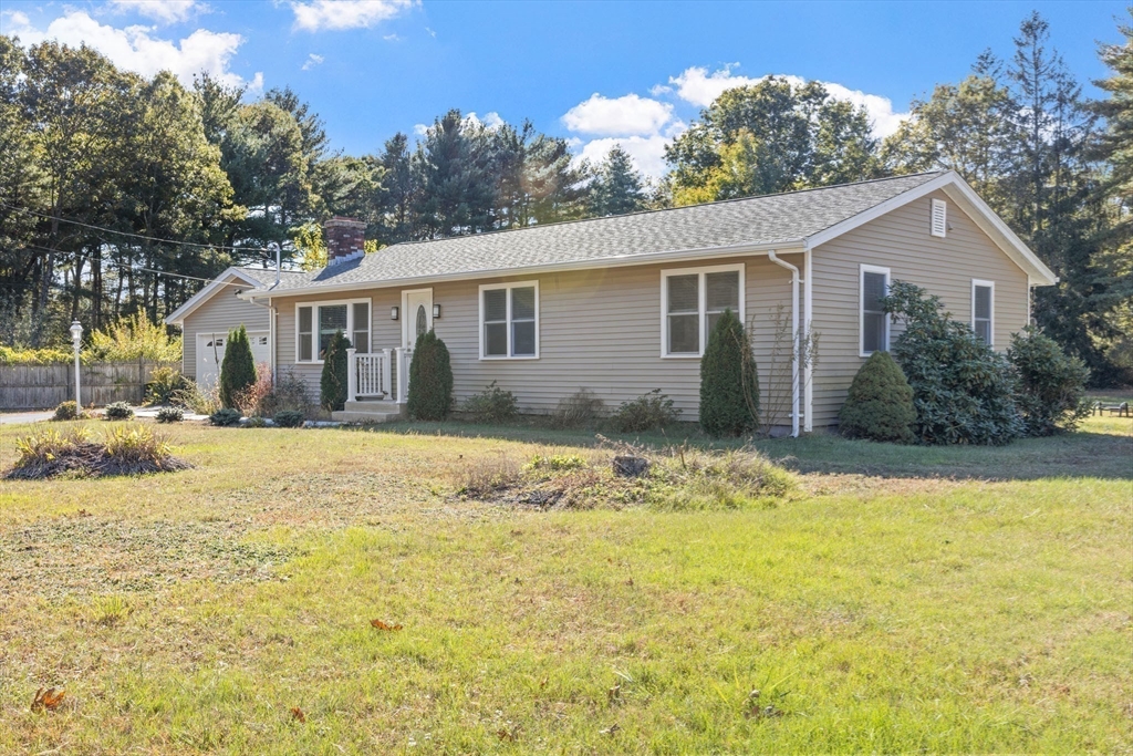 124 Lake Street Bellingham, MA 02019 - Photo 34 of 39 a front view of house with yard and trees around