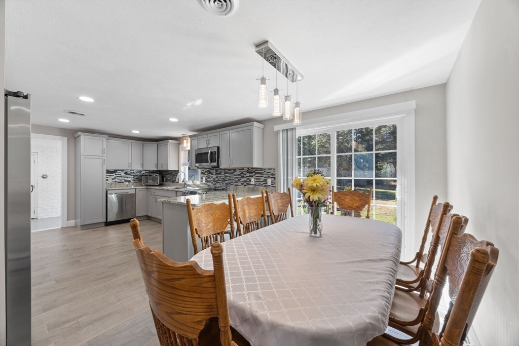 124 Lake Street Bellingham, MA 02019 - Photo 8 of 39 a dining room with furniture and window