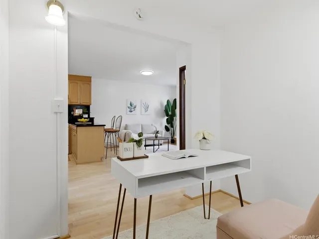 a dining room with furniture and wooden floor