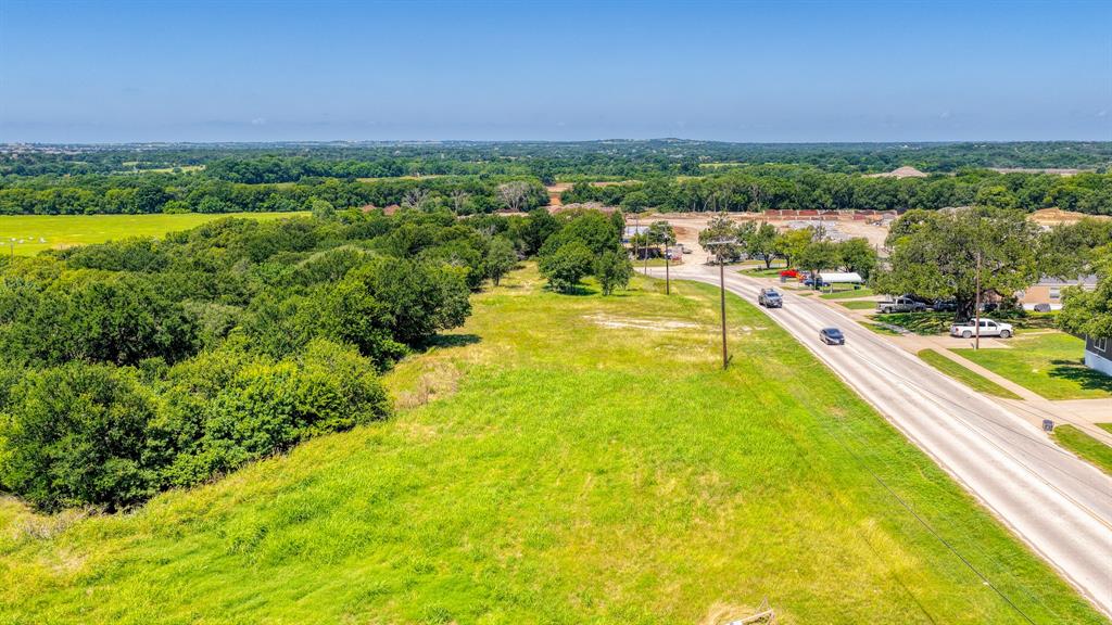619 Old Annetta Road Aledo, TX 76008 - Photo 12 of 16 Expansive undeveloped land featuring a cleared grassy area and mature tree lines