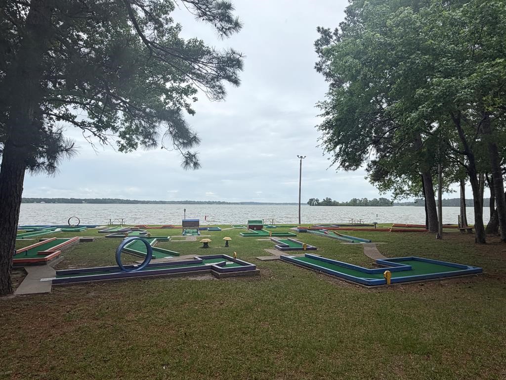 86 Whippoorwill Lane Trinity, TX 75862 - Photo 30 of 47 a view of a lake with couches in the back