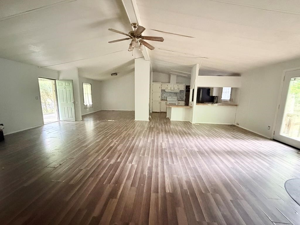 86 Whippoorwill Lane Trinity, TX 75862 - Photo 33 of 47 a view of a living room a wooden floor and a ceiling fan in a room