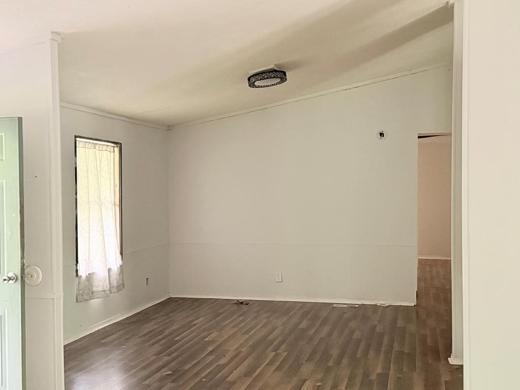 86 Whippoorwill Lane Trinity, TX 75862 - Photo 36 of 47 an empty room with wooden floor and windows