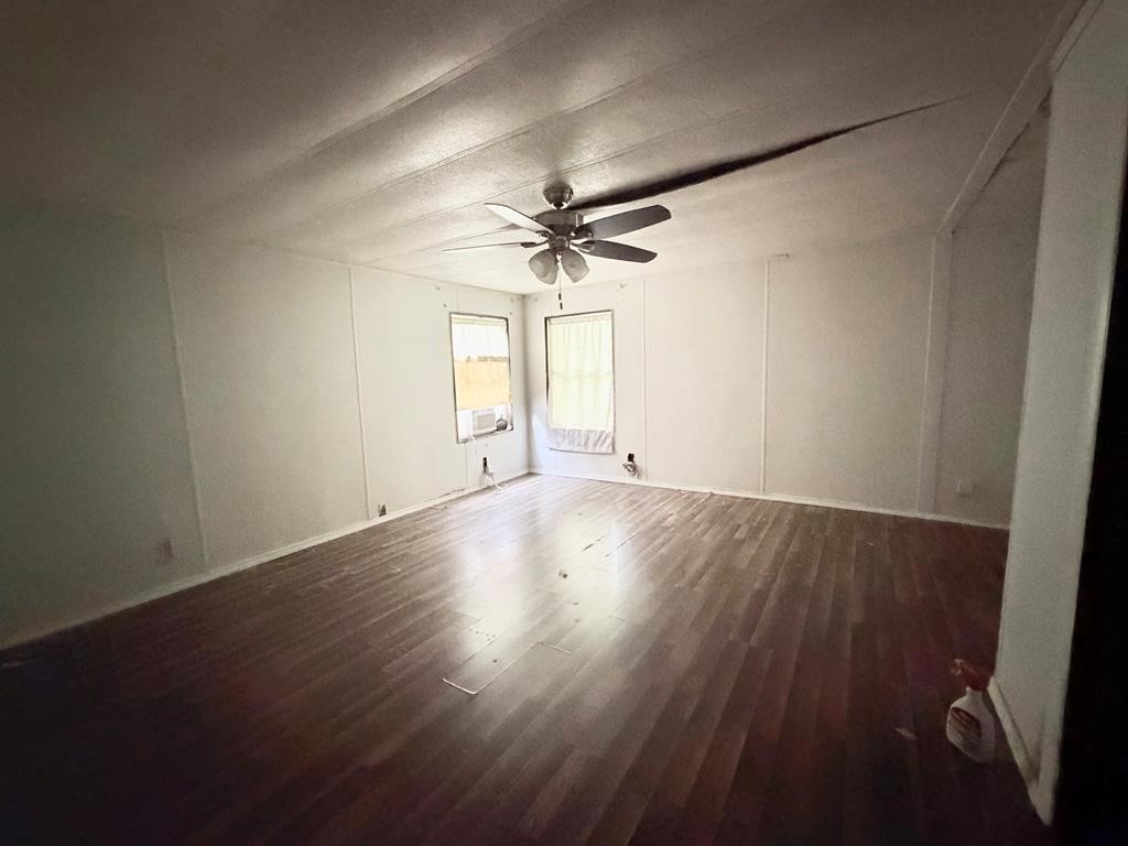 86 Whippoorwill Lane Trinity, TX 75862 - Photo 42 of 47 an empty room with wooden floor and windows