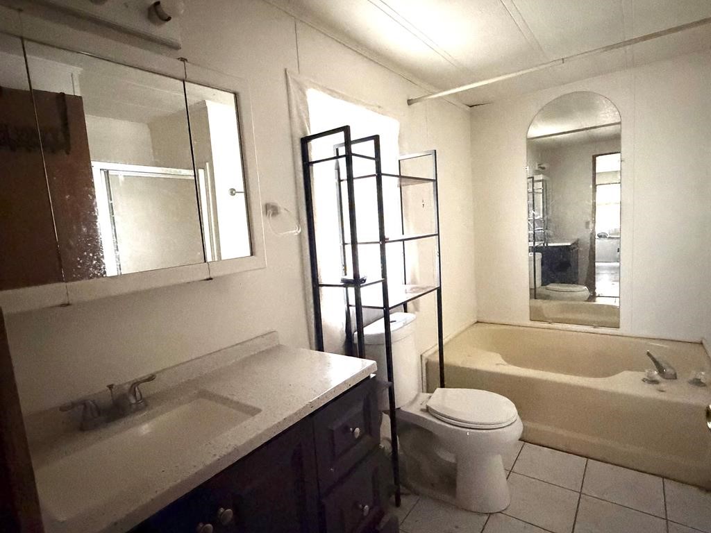 86 Whippoorwill Lane Trinity, TX 75862 - Photo 43 of 47 a bathroom with a sink a toilet and a bathtub