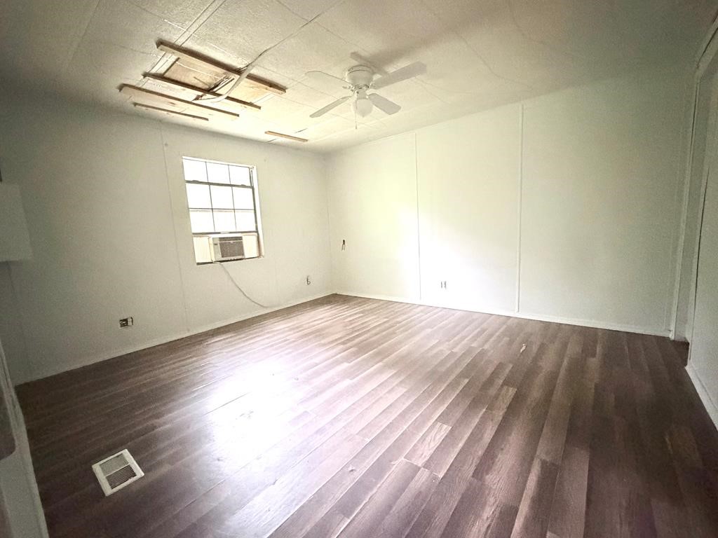 86 Whippoorwill Lane Trinity, TX 75862 - Photo 45 of 47 an empty room with wooden floor and windows