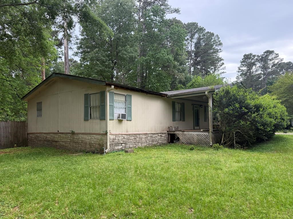 86 Whippoorwill Lane Trinity, TX 75862 - Photo 5 of 47 a view of a house with a yard and sitting area